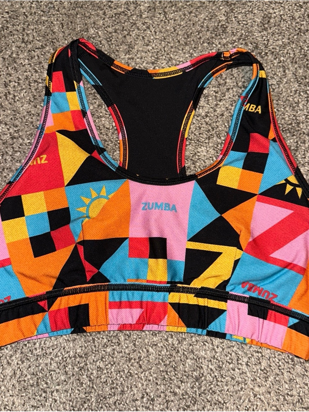 Zumba Fitness Multicolor Geometric Bikini Top in Orange, Pink, Blue & Black